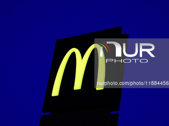 McDonald's logo is seen near the restaurant building in Poland on December 20, 2024. (