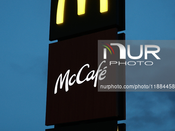 McDonald's, McCafe and McDrive logos are seen near the restaurant in Poland on December 20, 2024. (