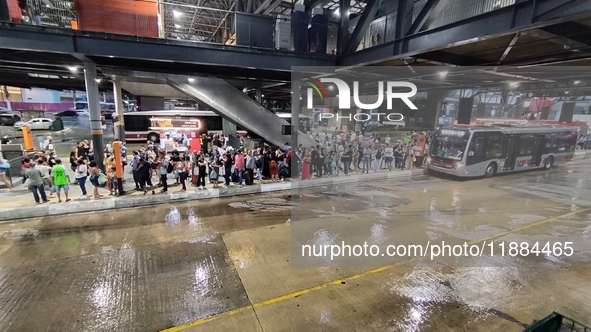 A storm hits the south zone of Sao Paulo in the region of the Joao Dias terminal in Sao Paulo, Brazil, on December 20, 2024, causing traffic...