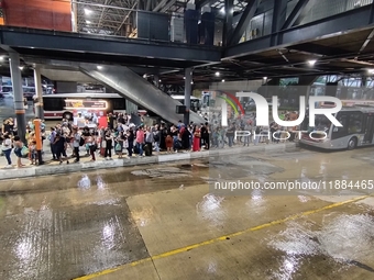 A storm hits the south zone of Sao Paulo in the region of the Joao Dias terminal in Sao Paulo, Brazil, on December 20, 2024, causing traffic...