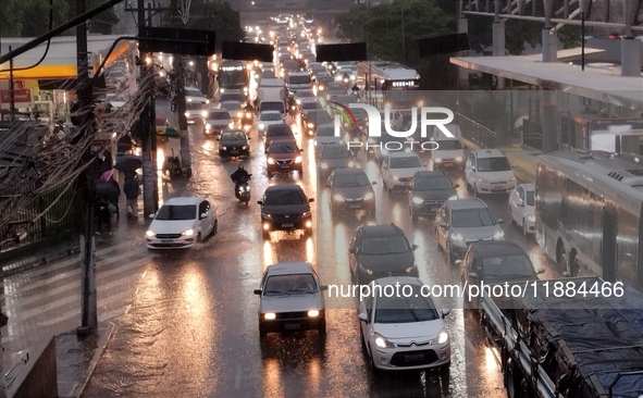 A storm hits the south zone of Sao Paulo in the region of the Joao Dias terminal in Sao Paulo, Brazil, on December 20, 2024, causing traffic...