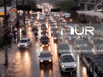 A storm hits the south zone of Sao Paulo in the region of the Joao Dias terminal in Sao Paulo, Brazil, on December 20, 2024, causing traffic...