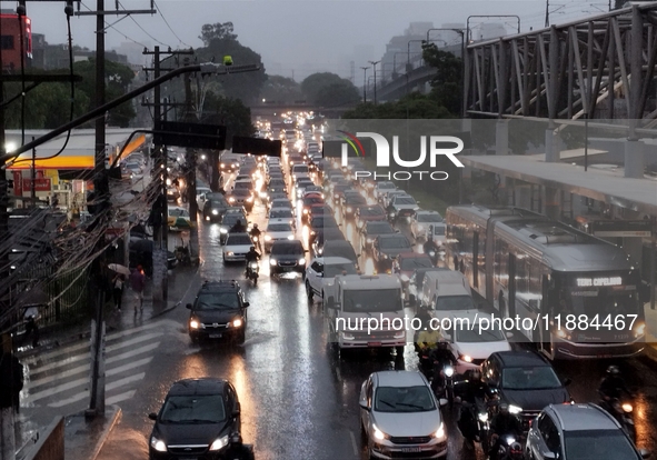 A storm hits the south zone of Sao Paulo in the region of the Joao Dias terminal in Sao Paulo, Brazil, on December 20, 2024, causing traffic...