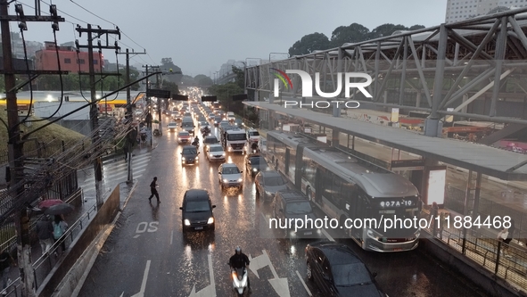 A storm hits the south zone of Sao Paulo in the region of the Joao Dias terminal in Sao Paulo, Brazil, on December 20, 2024, causing traffic...