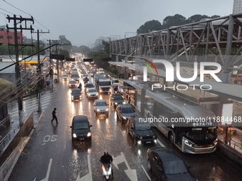 A storm hits the south zone of Sao Paulo in the region of the Joao Dias terminal in Sao Paulo, Brazil, on December 20, 2024, causing traffic...