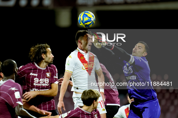 Luigi Sepe of US Salernitana and Gabriele Moncini of Brescia Calcio jump for the ball during the Serie BKT match between US Salernitana and...