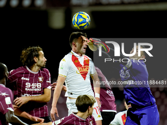 Luigi Sepe of US Salernitana and Gabriele Moncini of Brescia Calcio jump for the ball during the Serie BKT match between US Salernitana and...