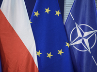 European Union (EU), Poland, and NATO flags are pictured in Warsaw, Poland, on December 20, 2024. (