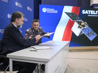 President of the Management Board of Creotech Instruments S.A., Grzegorz Brona (L), and the chief of the Polish Armament Agency, Artur Kupte...