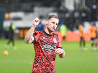 Tom Lees, 32, from Huddersfield, gestures to fans after the final whistle during the Sky Bet League 1 match between Cambridge United and Hud...