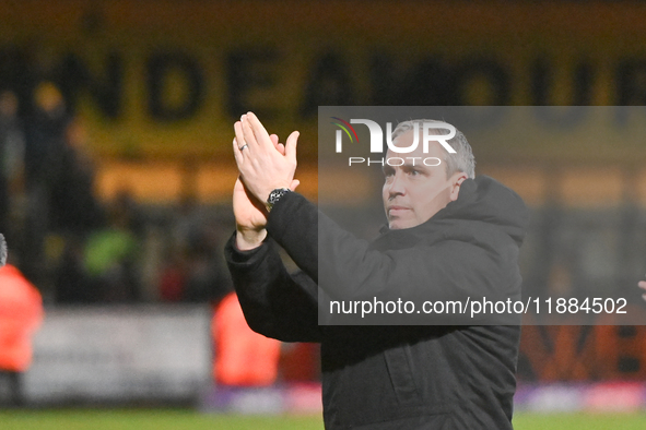 Manager Michael Duff of Huddersfield applauds fans after the final whistle during the Sky Bet League 1 match between Cambridge United and Hu...