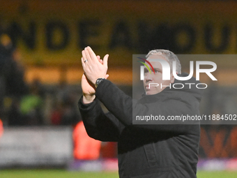 Manager Michael Duff of Huddersfield applauds fans after the final whistle during the Sky Bet League 1 match between Cambridge United and Hu...