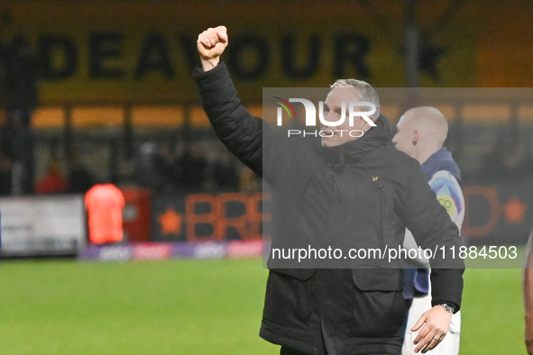 Manager Michael Duff of Huddersfield Town fist pumps to fans after the final whistle during the Sky Bet League 1 match between Cambridge Uni...