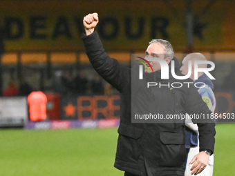 Manager Michael Duff of Huddersfield Town fist pumps to fans after the final whistle during the Sky Bet League 1 match between Cambridge Uni...