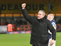 Manager Michael Duff of Huddersfield Town fist pumps to fans after the final whistle during the Sky Bet League 1 match between Cambridge Uni...