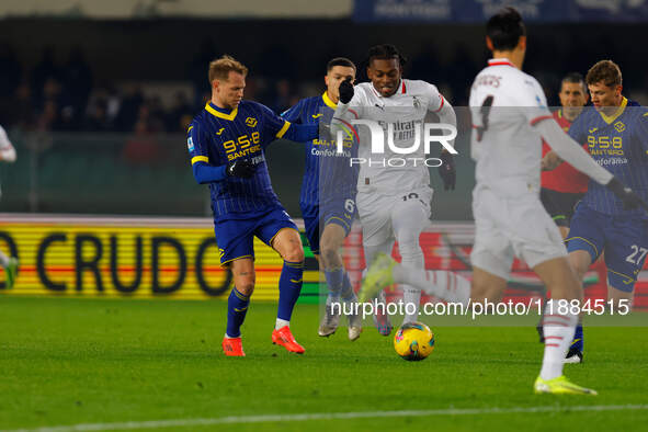 AC Milan's Rafael Leao plays against Hellas Verona's Reda Belahyane during the Italian Serie A Enilive soccer championship match between Hel...