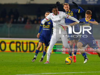 AC Milan's Rafael Leao plays against Hellas Verona's Reda Belahyane during the Italian Serie A Enilive soccer championship match between Hel...