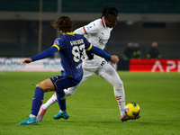 AC Milan's Rafael Leao competes against Hellas Verona's Daniele Ghilardi during the Italian Serie A Enilive soccer championship match betwee...