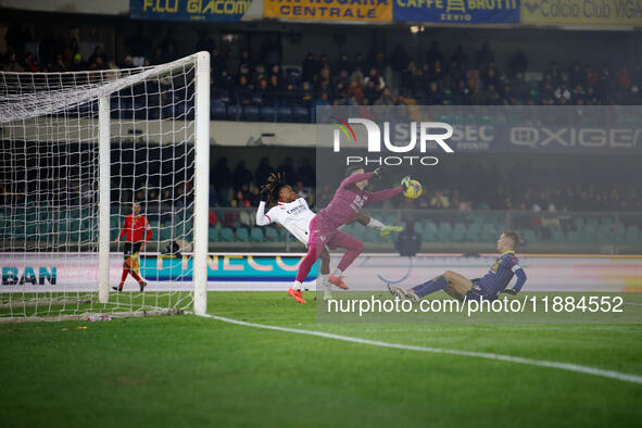 Lorenzo Montipo of Hellas Verona plays against Samuel Chukwueze of AC Milan during the Italian Serie A Enilive soccer championship match bet...