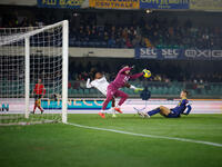 Lorenzo Montipo of Hellas Verona plays against Samuel Chukwueze of AC Milan during the Italian Serie A Enilive soccer championship match bet...