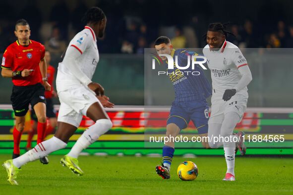 AC Milan's Rafael Leao plays against Hellas Verona's Reda Belahyane during the Italian Serie A Enilive soccer championship match between Hel...