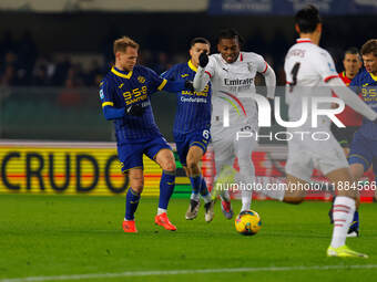 AC Milan's Rafael Leao plays against Hellas Verona's Reda Belahyane during the Italian Serie A Enilive soccer championship match between Hel...