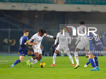 AC Milan's Samuel Chukwueze plays against Hellas Verona's Tomas Suslov during the Italian Serie A Enilive soccer championship match between...