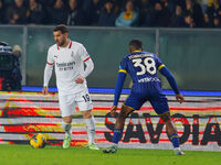 AC Milan's Theo Hernandez plays against Hellas Verona's Jackson Tchatchoua during the Italian Serie A Enilive soccer championship football m...