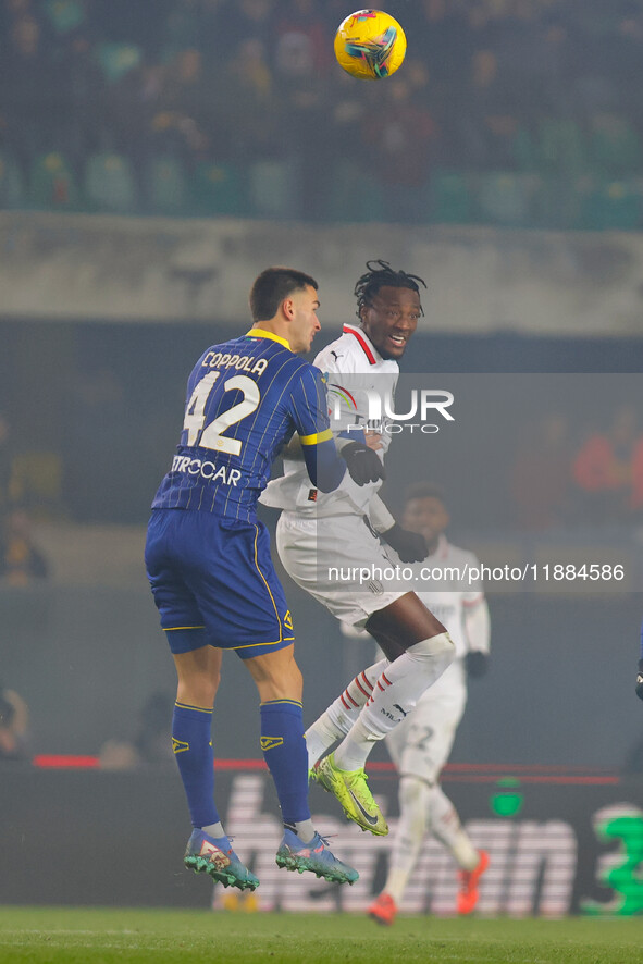 Tommy Abraham of AC Milan plays against Diego Coppola of Hellas Verona during the Italian Serie A Enilive soccer championship match between...