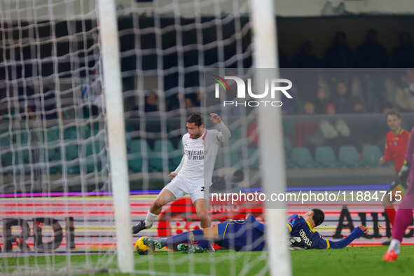 Davide Calabria of AC Milan plays against Diego Coppola of Hellas Verona during the Italian Serie A Enilive soccer championship match betwee...