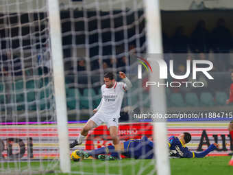 Davide Calabria of AC Milan plays against Diego Coppola of Hellas Verona during the Italian Serie A Enilive soccer championship match betwee...