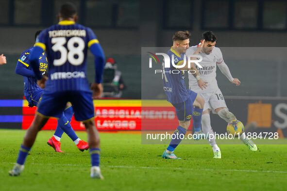 AC Milan's Theo Hernandez plays against Hellas Verona's Tomas Suslov during the Italian Serie A Enilive soccer championship football match b...