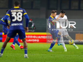 AC Milan's Theo Hernandez plays against Hellas Verona's Tomas Suslov during the Italian Serie A Enilive soccer championship football match b...