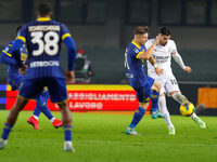 AC Milan's Theo Hernandez plays against Hellas Verona's Tomas Suslov during the Italian Serie A Enilive soccer championship football match b...