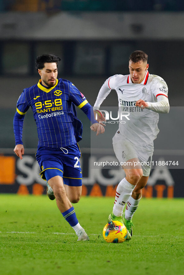 AC Milan's Filippo Terracciano plays against Hellas Verona's Suat Serdar during the Italian Serie A Enilive soccer championship football mat...