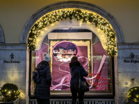 People on the street for window shopping and buying presents in Munich, Bavaria, Germany, on December 20, 2024 (