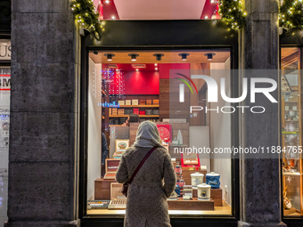 People on the street for window shopping and buying presents in Munich, Bavaria, Germany, on December 20, 2024 (