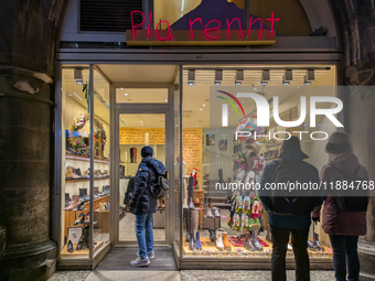 People on the street for window shopping and buying presents in Munich, Bavaria, Germany, on December 20, 2024 (