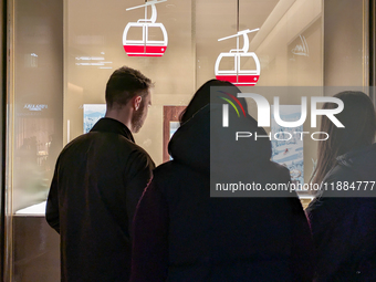 People on the street for window shopping and buying presents in Munich, Bavaria, Germany, on December 20, 2024 (