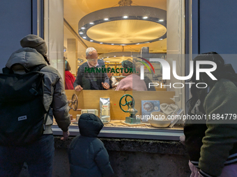 People on the street for window shopping and buying presents in Munich, Bavaria, Germany, on December 20, 2024 (