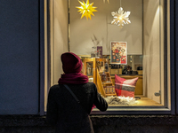 People on the street for window shopping and buying presents in Munich, Bavaria, Germany, on December 20, 2024 (