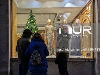 People on the street for window shopping and buying presents in Munich, Bavaria, Germany, on December 20, 2024 (