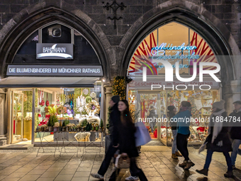 People on the street for window shopping and buying presents in Munich, Bavaria, Germany, on December 20, 2024 (