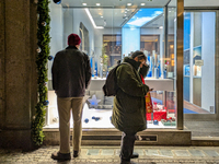 People on the street for window shopping and buying presents in Munich, Bavaria, Germany, on December 20, 2024 (