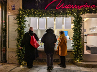 People on the street for window shopping and buying presents in Munich, Bavaria, Germany, on December 20, 2024 (