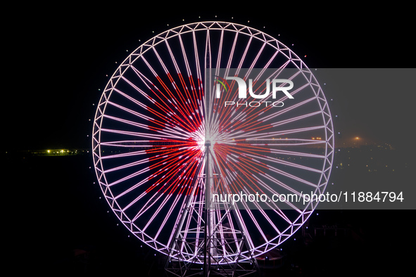 The 120-meter-high ''Chongqing Eye Ferris Wheel'' in Happy Valley opens for operation after an upgrade in Chongqing, China, on December 20,...