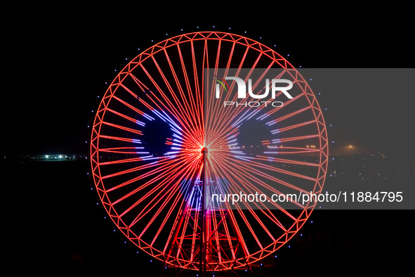 The 120-meter-high ''Chongqing Eye Ferris Wheel'' in Happy Valley opens for operation after an upgrade in Chongqing, China, on December 20,...