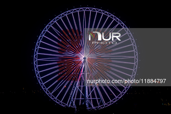 The 120-meter-high ''Chongqing Eye Ferris Wheel'' in Happy Valley opens for operation after an upgrade in Chongqing, China, on December 20,...