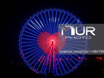 The 120-meter-high ''Chongqing Eye Ferris Wheel'' in Happy Valley opens for operation after an upgrade in Chongqing, China, on December 20,...