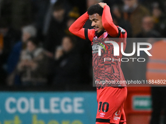 Josh Koroma (10 Huddersfield) holds his head after going close during the Sky Bet League 1 match between Cambridge United and Huddersfield T...